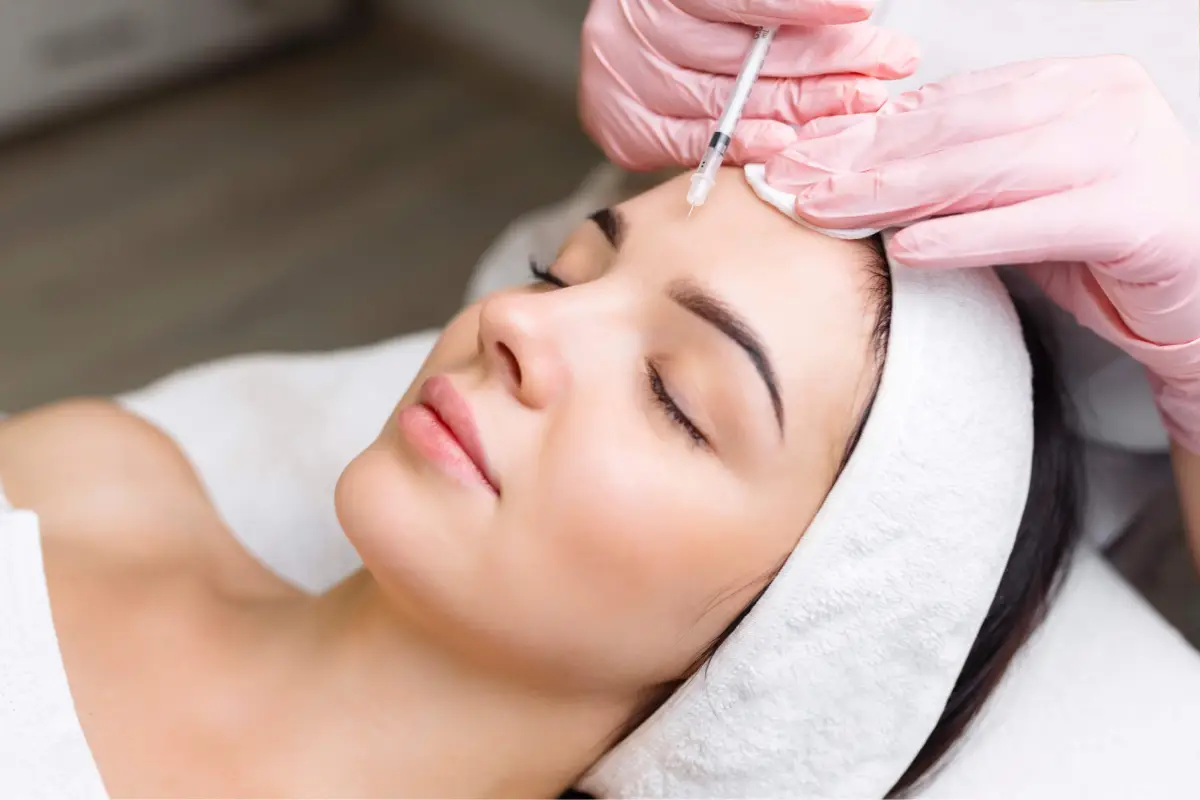 Woman receiving an injectable anti-aging skin treatment in Liverpool, NY, targeting forehead lines and dynamic wrinkles for a smoother, more youthful appearance.